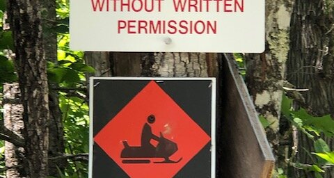 Sign indicating no trespassing without written permission